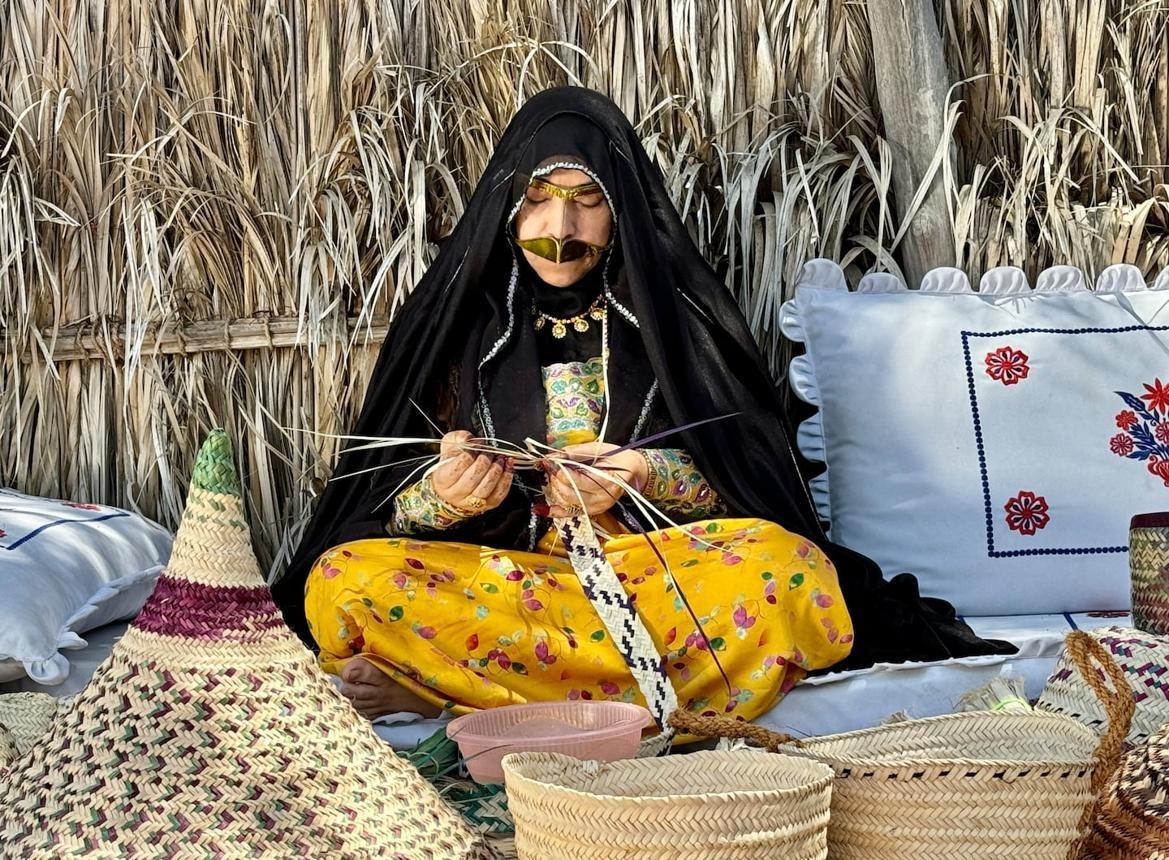 Traditional structures and displays at Abu Dhabi Heritage Village